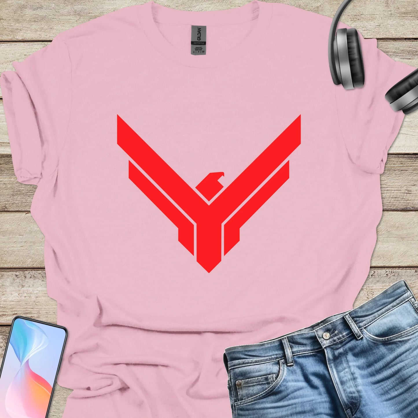 Pink t-shirt featuring red Atreides hawk emblem from Dune universe